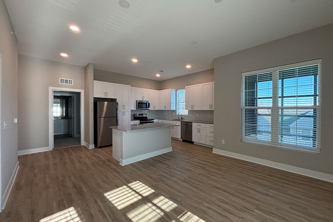 Bright and spacious living area and kitchen at Mission Flats Apartments in Mission, Kansas
